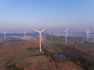 Wall Mural - Aerial view of wind turbine sunset. Sustainable development, environment friendly, renewable energy concept.