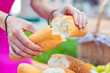 © zinkevych - Freshly baked. Selective focus of a loaf of bread being torn in two pieces