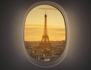 eiffel as seen through window of an aircraft.