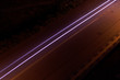 Long exposure of car , which is passing through street.