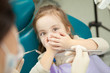 © Ilshat - Kid afraid of procedure closes mouth with hands