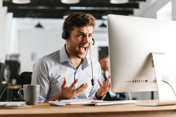 Poster - Displeased office manager screaming by headset with microphone