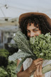 © Rawpixel.com - Beautiful woman buying kale at a farmers market