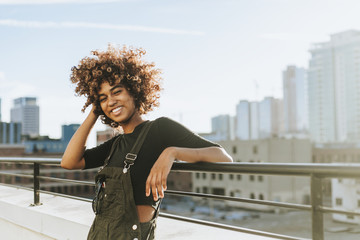 Girl with curly hair at a LA rooftop