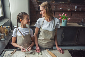 Wall Mural - Mom and daughter baking