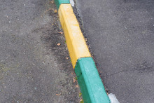 Painted Kerbstone On Sidewalk