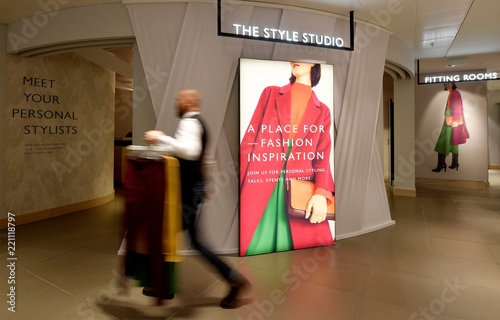 An Employee Carries Clothes At The John Lewis And Partners Retail
