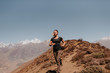 © Connect Images - Woman jogging down from peak, Annapurna Circuit, the Himalayas, Muktinath, Nepal