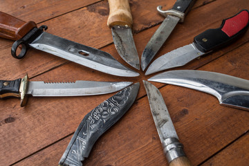 Knifes in a circle on a table