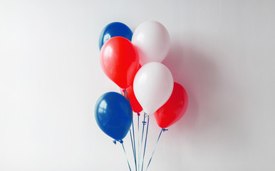 holidays and decorations concept - red, white and blue air balloons for 4th of july or birthday party