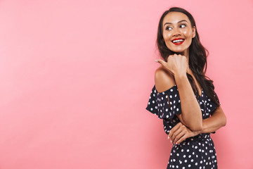 Poster - Side view of smiling brunette woman in dress