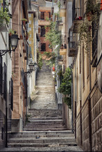 Old Street With Stairs In Granada In Spain.