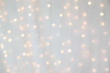 bokeh of yellow led light under curtain.
