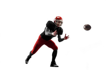 Active one american football player isolated on white background. Fit caucasian man in uniform posing over studio background. Human emotions and facial expressions concept