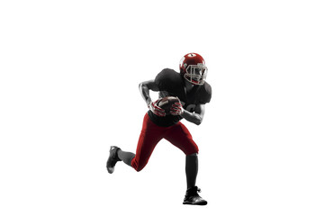 Active one american football player isolated on white background. Fit caucasian man in uniform running over studio background in jump or motion. Human emotions and facial expressions concept