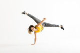 Attractive Young Woman Doing A Freeze Breakdance Move