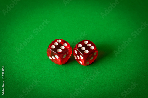фотография Dice on a green background . Game concept. Games of chance