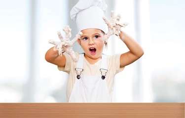 Wall Mural - Little girl cooking