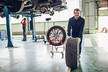 Auto car repair service center. Mechanic at work