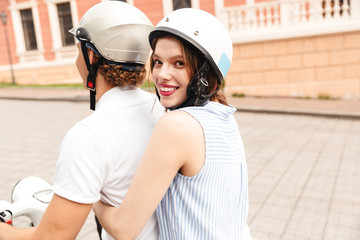 Portrait of a smiling young couple in helmets