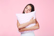 © 5second - Young girl with pillow on pink background