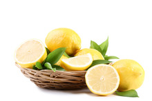 Ripe Lemons In Basket Isolated On White Background