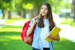 © 5second - Cute girl with backpack and notebook in the park