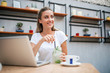 © bnenin - Young woman in city cafe in the summer.