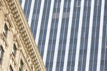 An old building with a modern building in the background