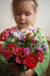 © Jane - girl holding a colourful bouquet/mothers day /birthday background
