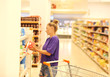© lado2016 - Woman choosing a dairy products at supermarket
