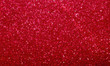 Vivid red sparkle glitter and shine for background. Beautiful Holiday backdrop for Christmas, New Years or Thanksgiving.  Winter fall, autumn theme abstract background.