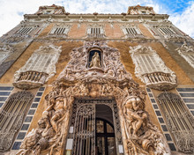 Ornate Alabaster Stone Facade Of The Historic Palace Of Marques De Dos Aguas National Ceramic Museum In Valencia, Spain.