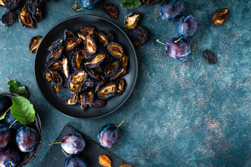 Canvas Print - Dried prune and fresh plums with leaves