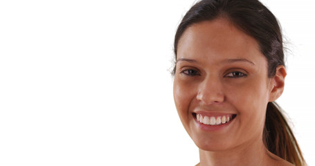 Wall Mural - Close up portrait of cheerful Caucasian woman laughing on white background