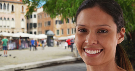 Wall Mural - Closeup portrait of beautiful tourist woman on street in Venice enjoying holiday