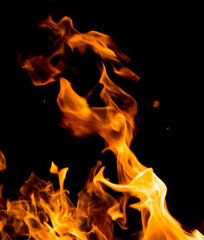 Flame of fire with sparks on a black background