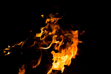 Flame of fire with sparks on a black background