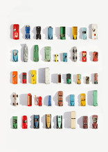 Collection Of Model Car Collectables Set Against White Background