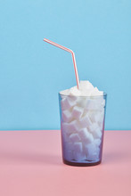 Glass Filled With Sugar Cubes And Straw