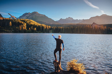 Wall Mural - Man by lake in High Tatras, Slovakia