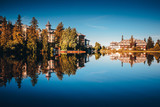 Fototapeta Nowy Jork - Luxury hotels by lake in mountains. Accommodation concept photo