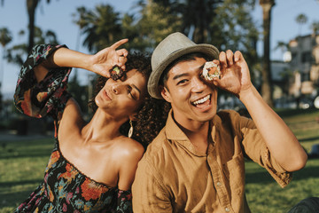 Friends having sushi at the park