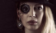 Steampunk girl portrait on black. Monocular lens