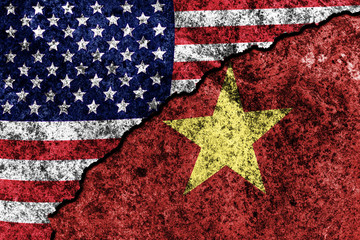 Wall Mural - two flags of the USA and Vietnam on a cracked concrete wall