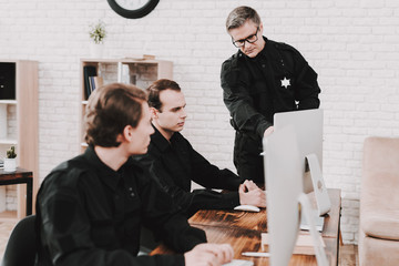 Wall Mural - Officer Instructs Subordinates In Police Station.