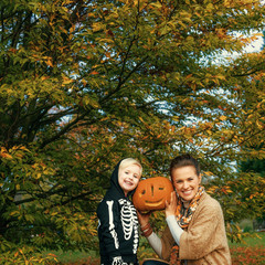 Sticker - mother and daughter showing carved Halloween pumpkin