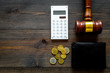 Financial failure, bankruptcy concept. Judge gavel, wallet, coins, calculator on dark wooden background top view copy space