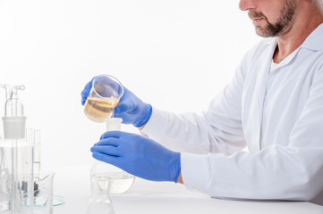 man in the laboratory / view of a man in the laboratory while performing experiments
