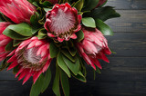 Fototapeta Kwiaty - Bunch of red artichoke protea